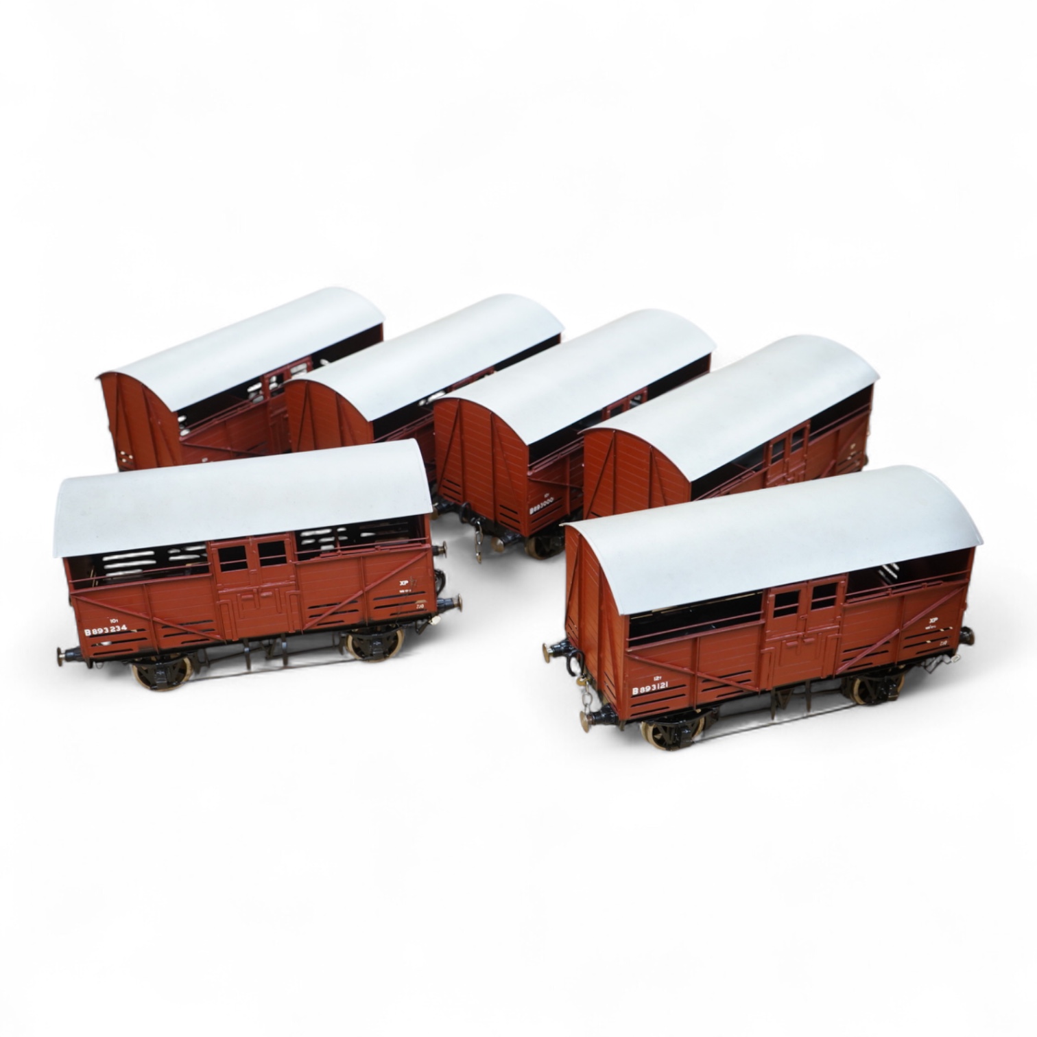 Six Gauge 3 model railway cattle trucks, of all metal construction built by Richard Toplis, well detailed and painted to a high standard